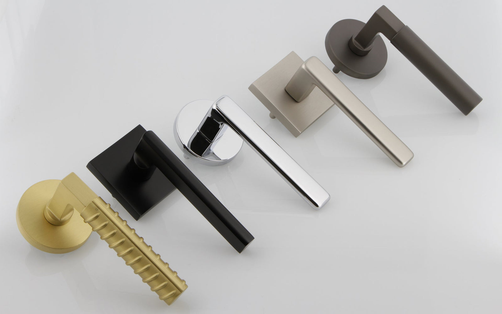 a collection of luxurious door levers from viaggio hardware