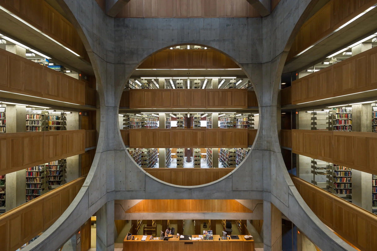 a modern contemporary interior design kahn library with circular shapes used as cement construction supports