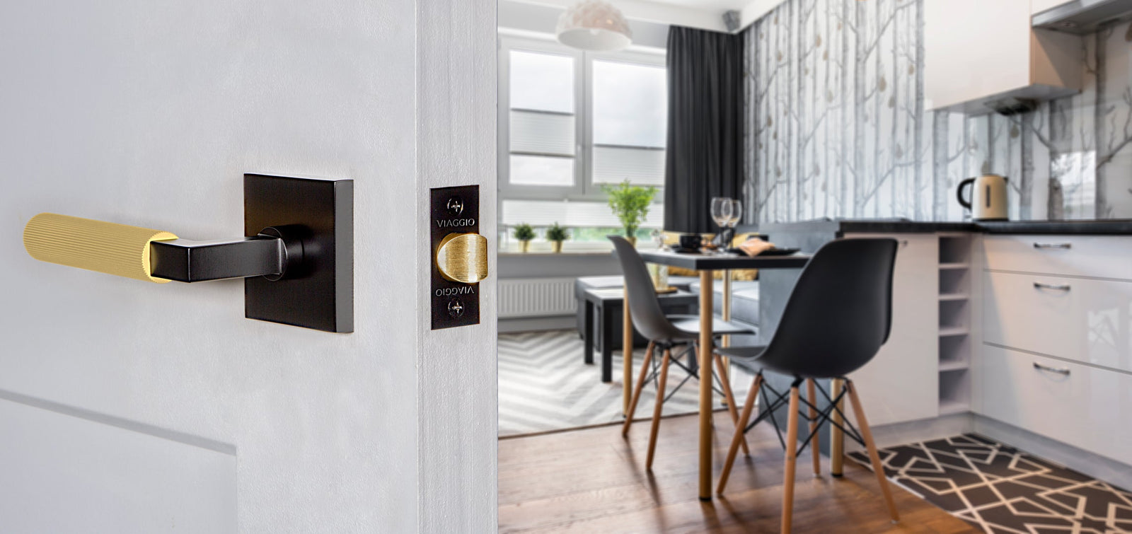 modern black and white kitchen with black and gold door hardware lever from viaggio